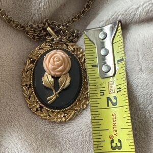 Vintage Avon necklace flip over with mirror.